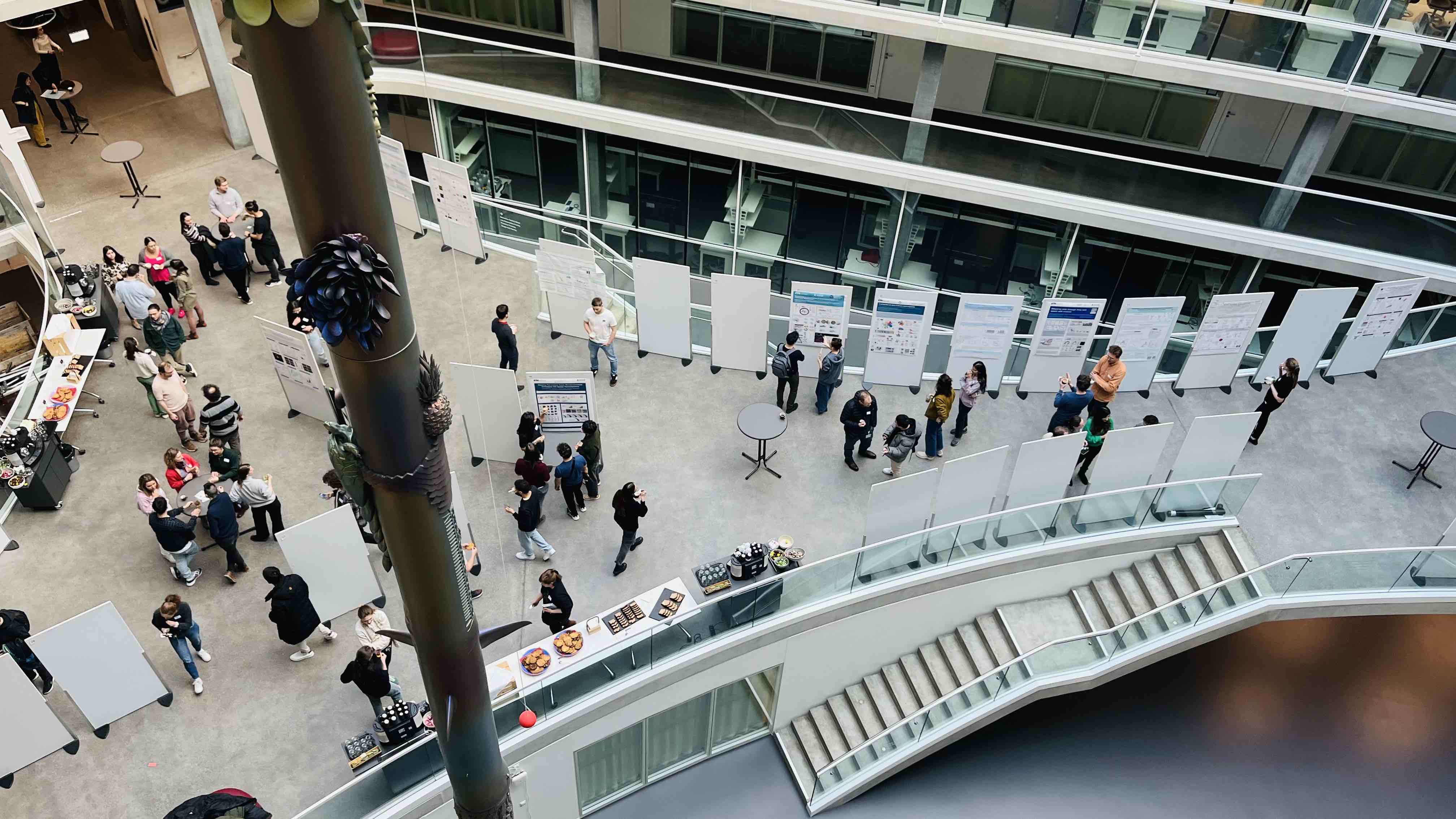 Enlarged view: photo of young scientists mingling at the poster session